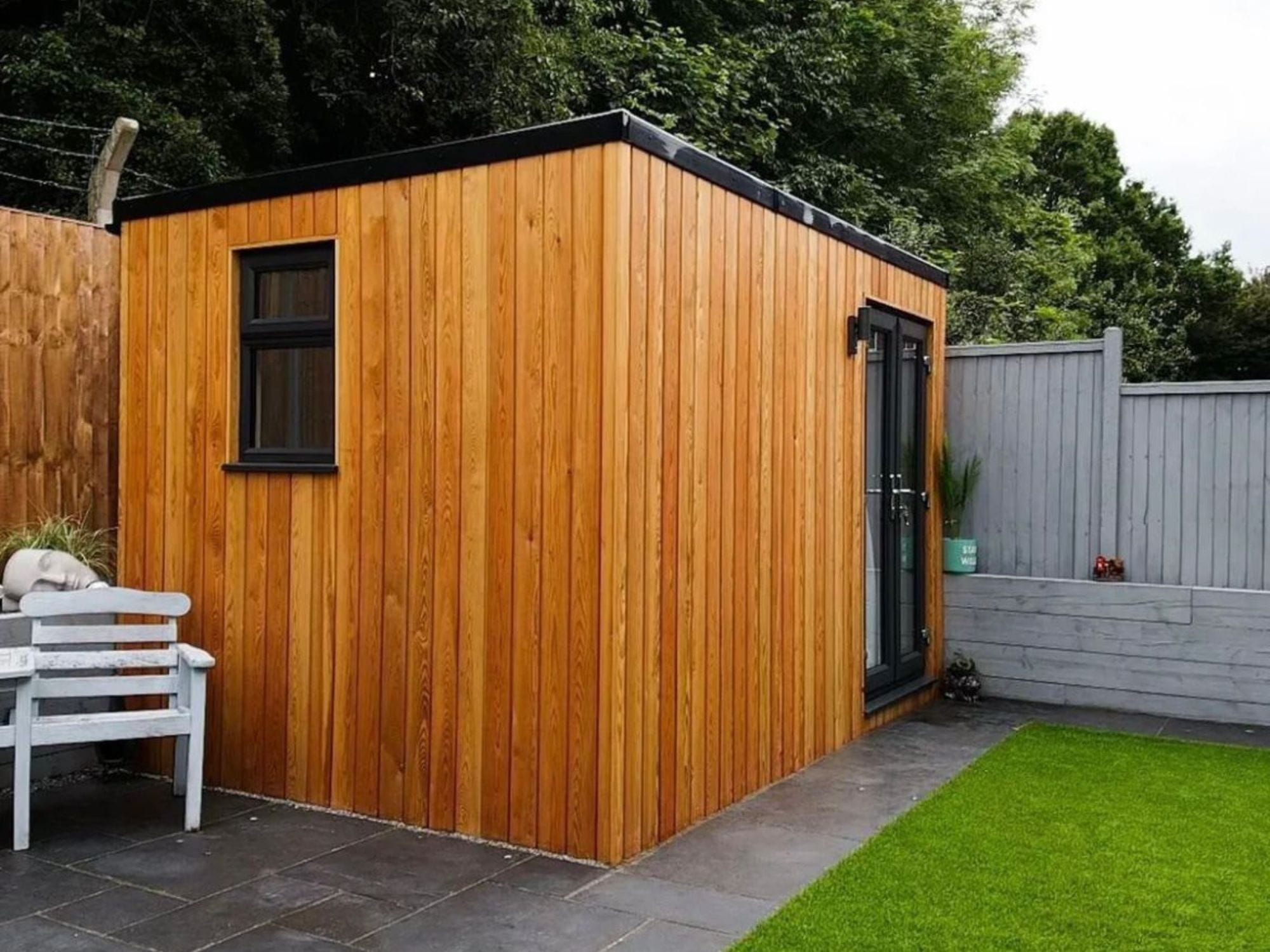 New home office to rear of garden, with doors and windows.